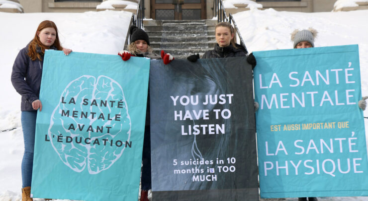 Students were equipped with various signs during the Feb. 28 demonstration. Photo: Emilie Azevedo/The Fulcrum