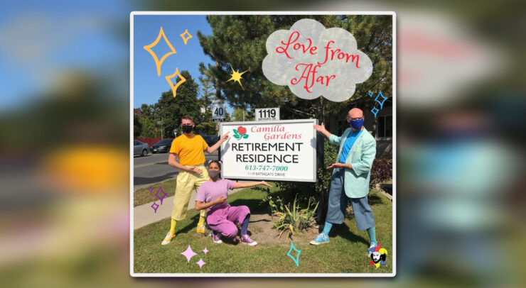 a Company of Fools performers in front of a nursing home sign