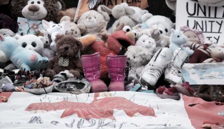 Stuffed animals are used as a stark remainder of the children who went to residential school