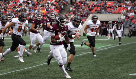 Gee-Gees running back carrying the ball