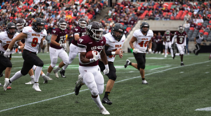 Gee-Gees running back carrying the ball