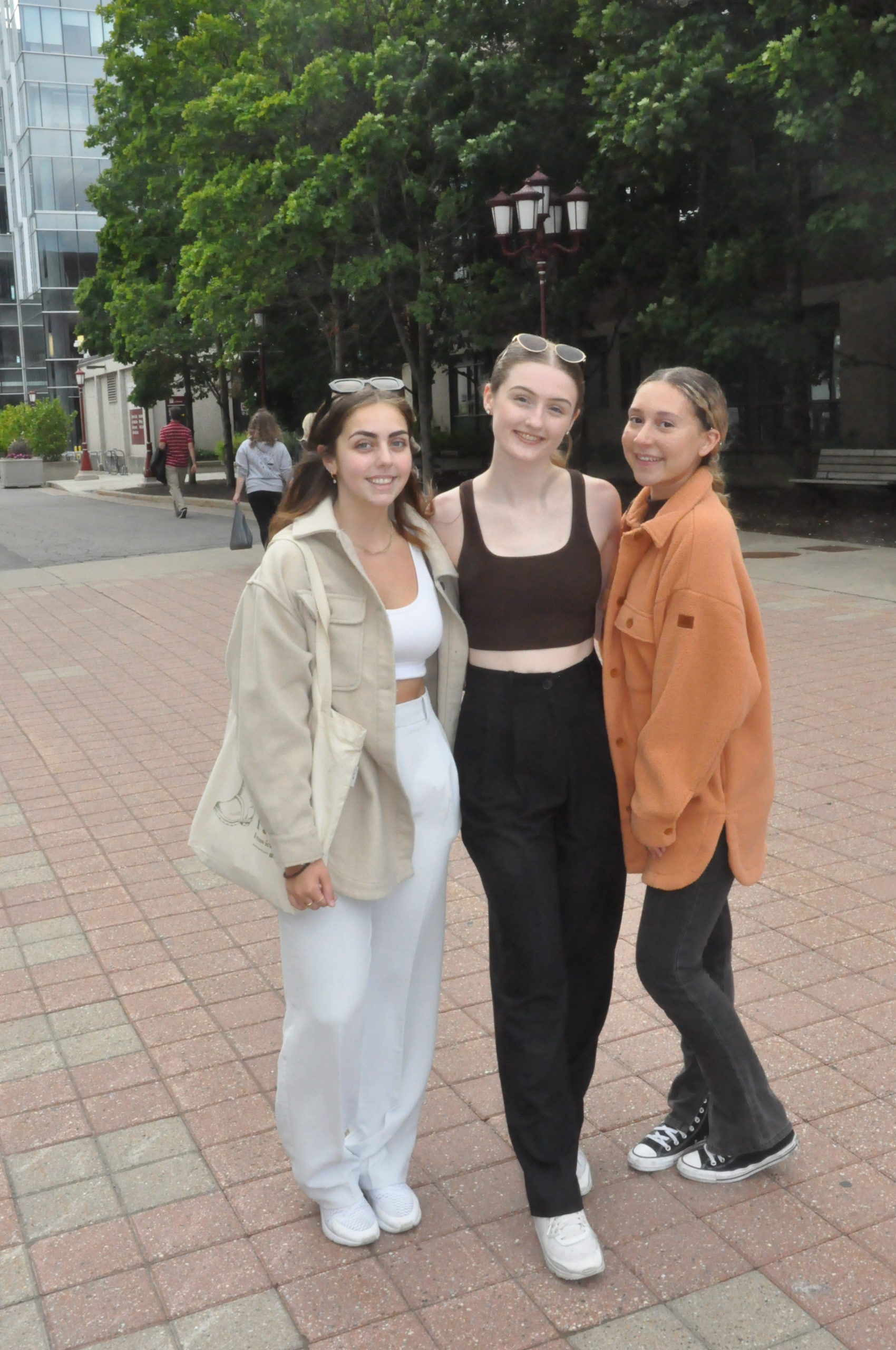 Three students wearing loose pants with shackets