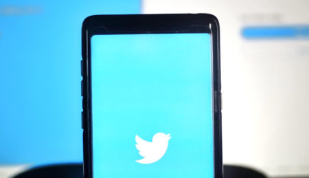 Iphone with Twitter logo on the screen
