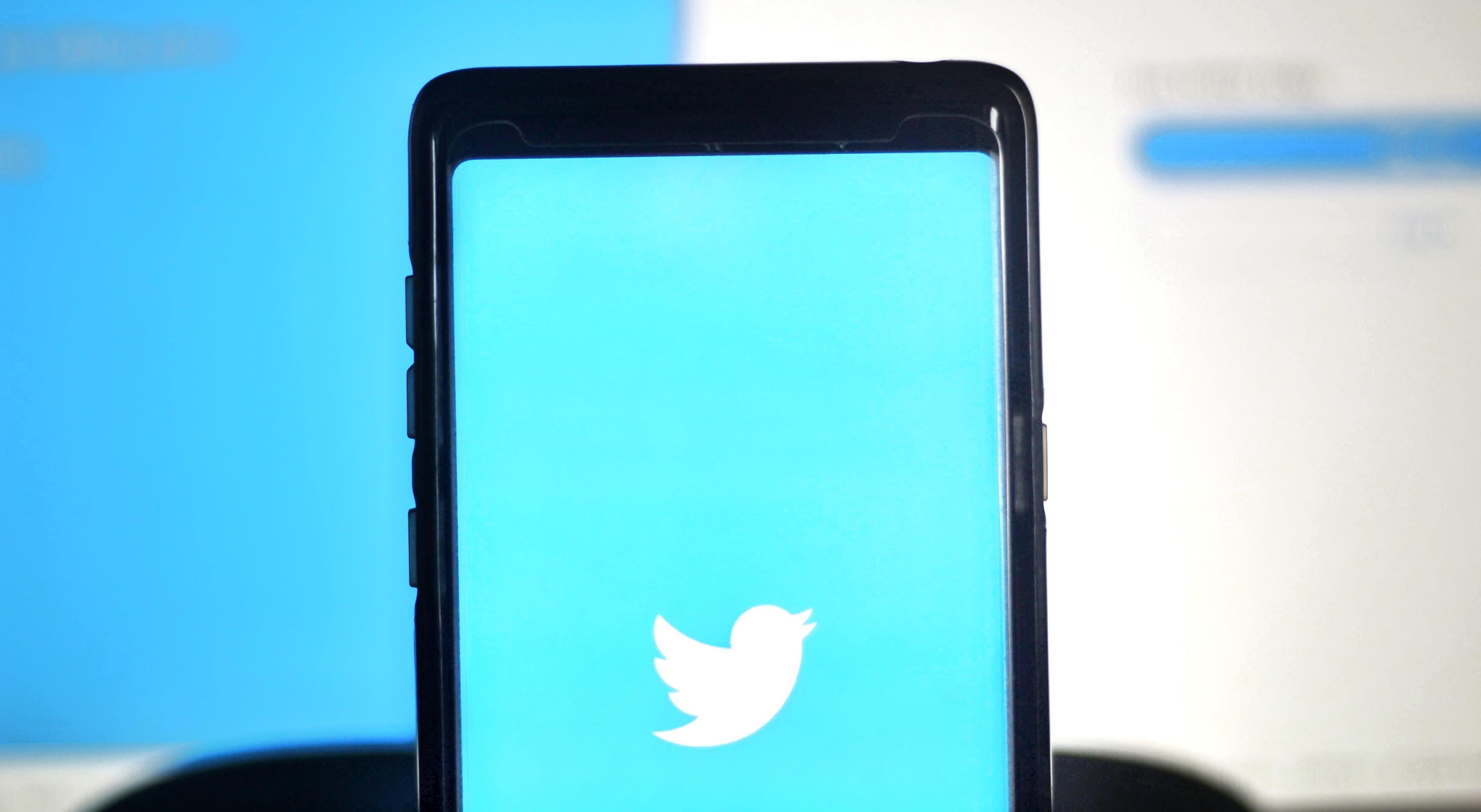 Iphone with Twitter logo on the screen