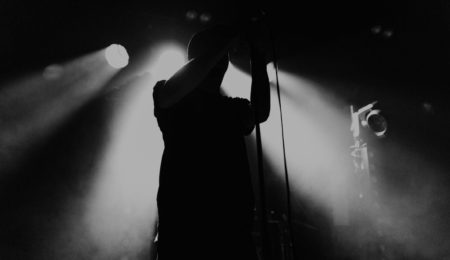Silhouetted singer on stage