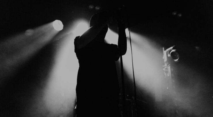 Silhouetted singer on stage