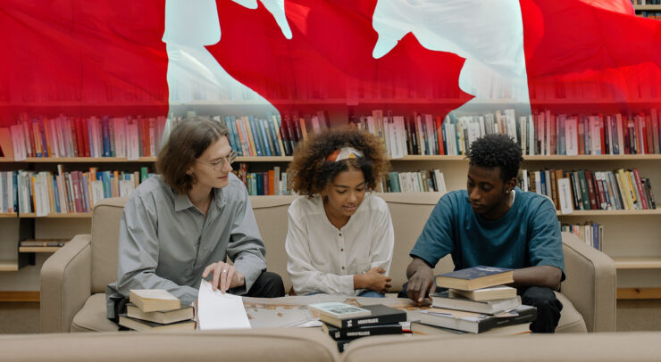 Students with the Canadian flag in the background