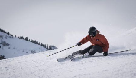person skiing down slope