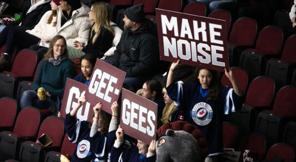 Fans cheering on the team.