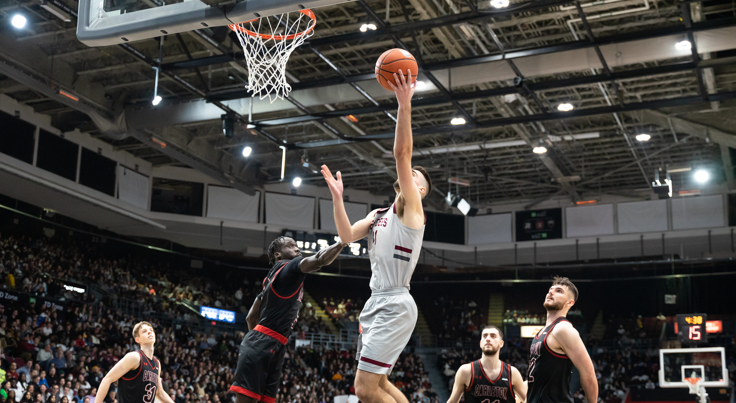 Guillaume Pepin lays the ball in the hoop