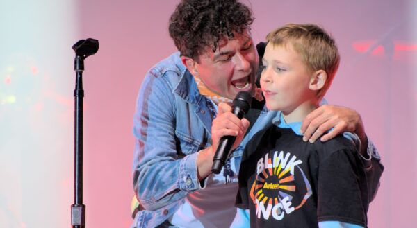 Young fan on stage