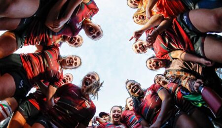 womens rugby team in a circle