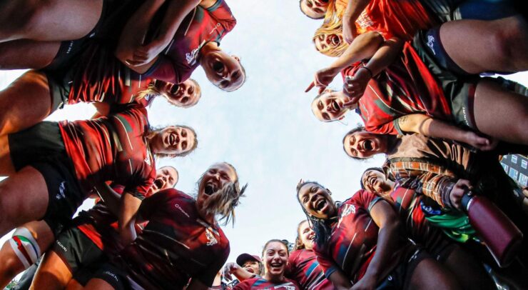 womens rugby team in a circle