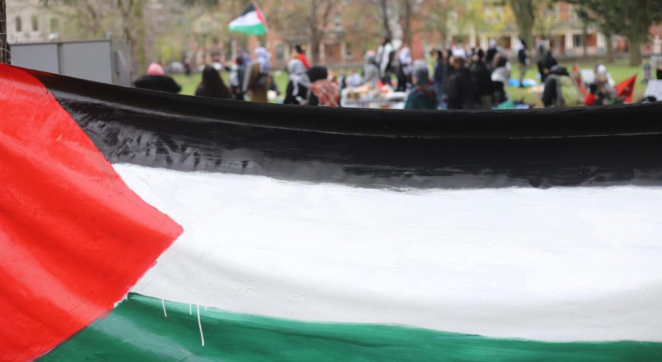Palestinian flag painted on banner.