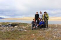 Team of scientists pose at the research site in Nunavut.