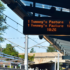 A sign with light rail wait times: “tunney’s pasture comes in 7 mins; tunney’s pasture comes in 17 mins”