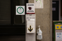 a mask dispenser sits on the U of O's campus