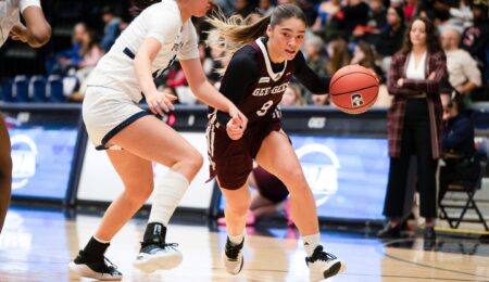 Natsuki Szczokin driving past a U of T defender