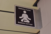 Close-up shot of a sign that reads “meditation and prayer”