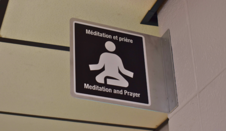 Close-up shot of a sign that reads “meditation and prayer”