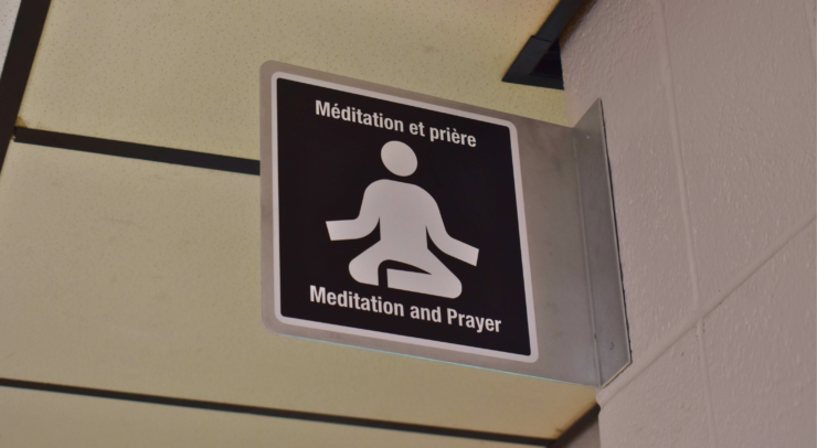 Close-up shot of a sign that reads “meditation and prayer”