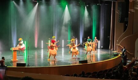 Dancers perform a vibrant traditional Cameroon routine at the Black Excellence Gala, celebrating cultural heritage through movement and rhythm.