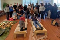 Student gather around improvised build project