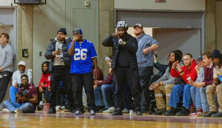 kwabana in a saquon barkley jersey courtside