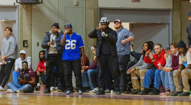 kwabana in a saquon barkley jersey courtside