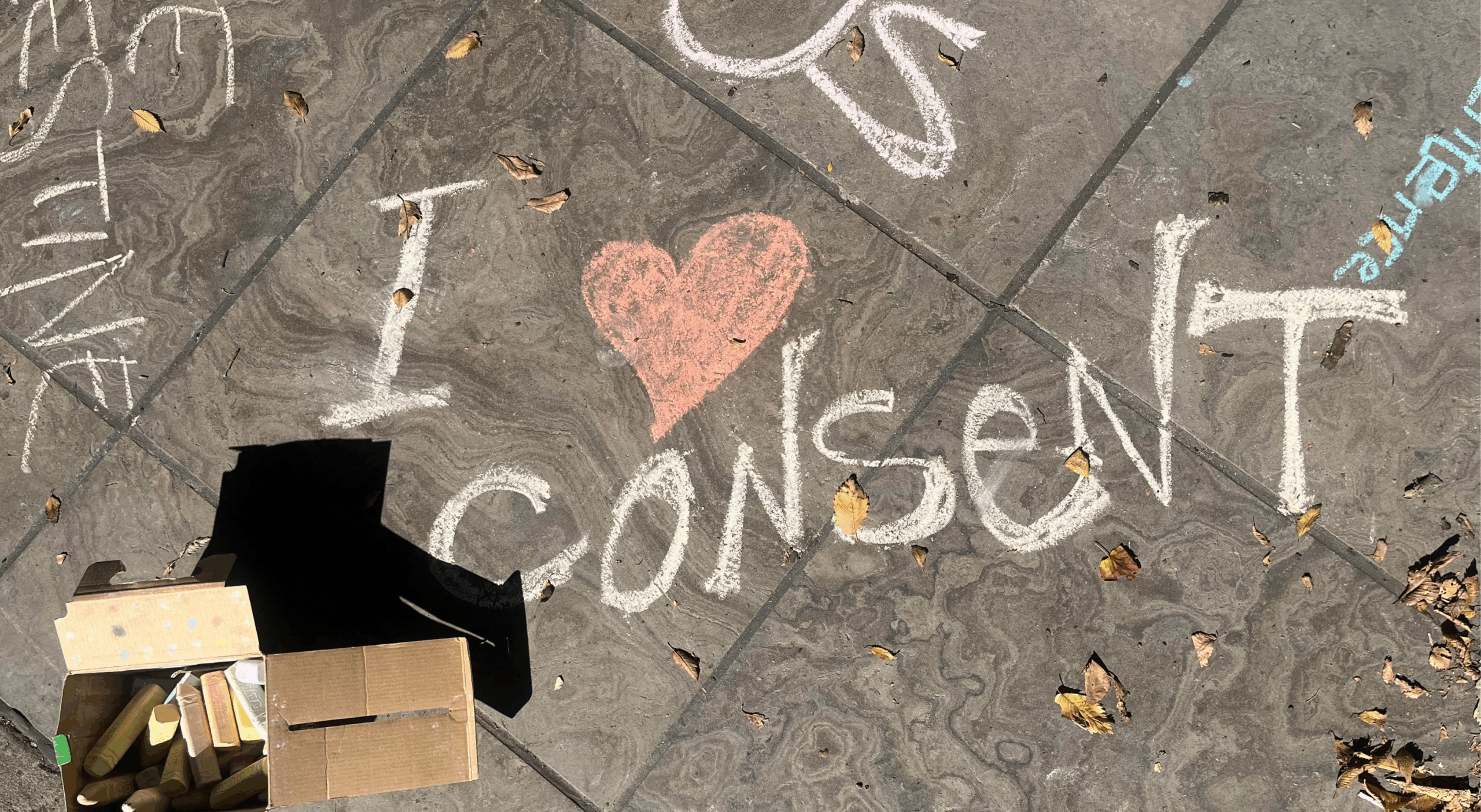 Chalk on the sidewalk in front of the Human Rights Monument "I heart consent"