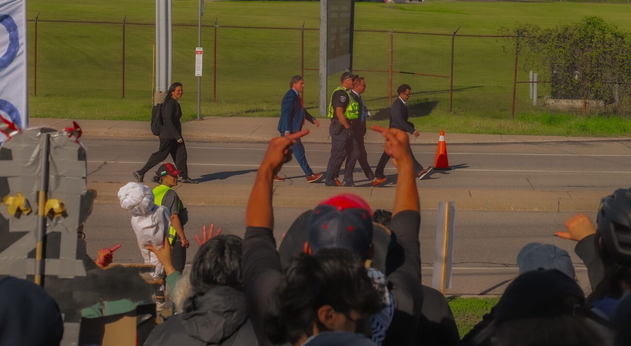 CANSEC attendees being heckled. Photo: Bhoomi Dahiya/The Fulcrum.